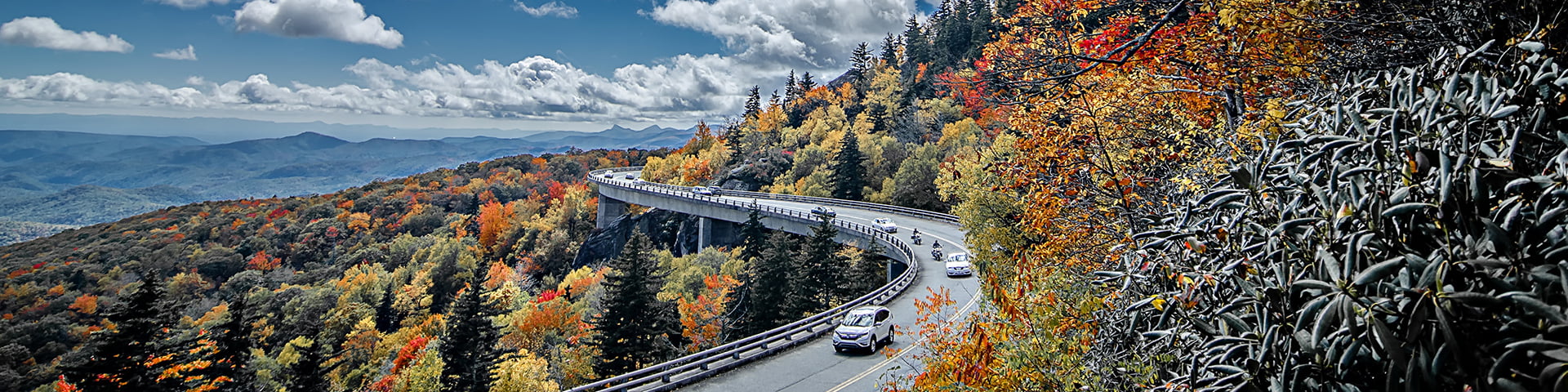 Scene of fall color along the Blue Ridge Parkway including span of the Grandfather Mountian bridge